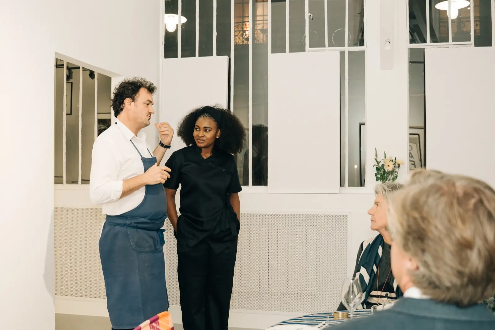 Chef Dee speaking to the guests